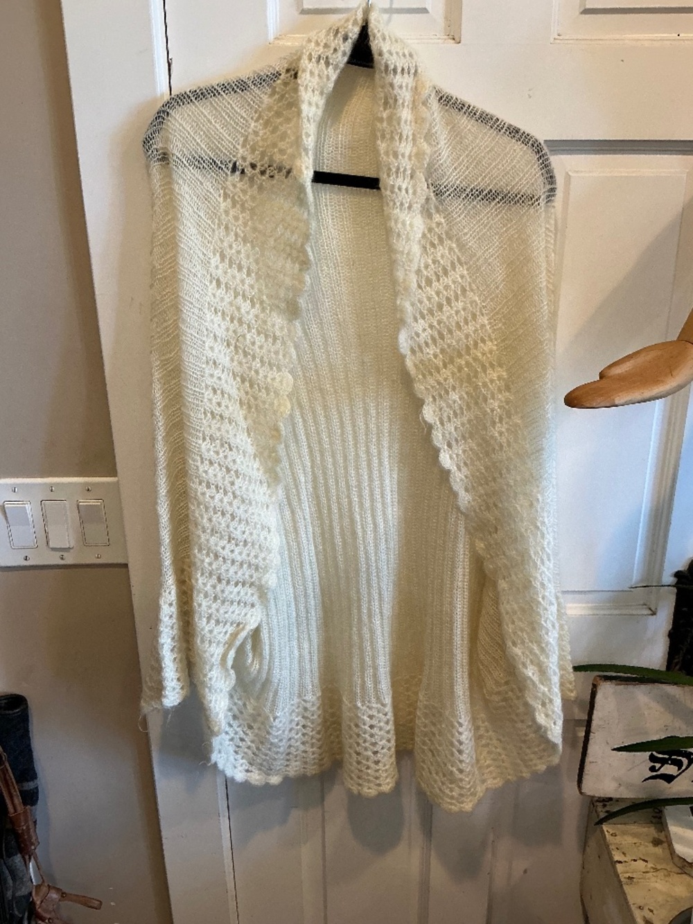 Moda intern wool blend wrap sweater in a soft white with ruffled edges! Size m/l
